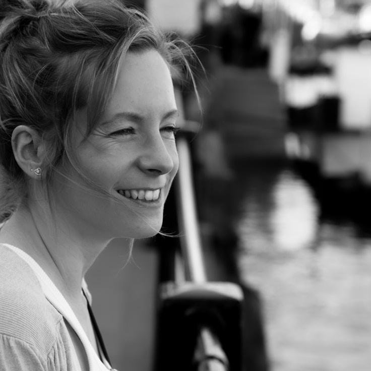 Kaveri Mehta, Lead Design Curator at Ocean Mountain Reflection, reviewing corporate floral arrangements